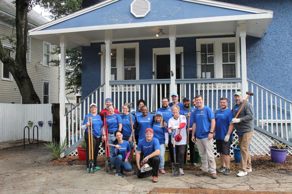 Generation W’s Pixie Larizza (in white) with many of the two dozen Deutsche Bank employees and friends who worked at JASMYN at a community service event.