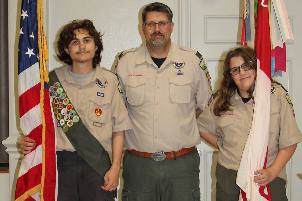 Troop 522 Scout Nathan Deese with Troop 465 Scoutmaster Sean Deese and Scout Brooke Deese
