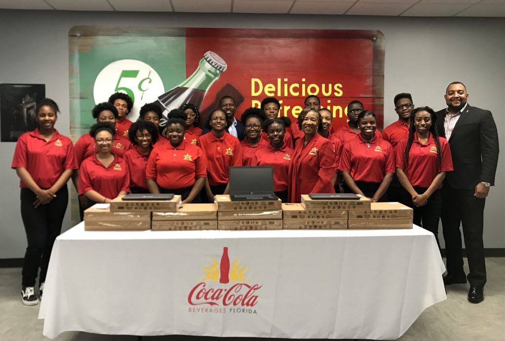 I'm A Star students receive laptops donated by Coke Florida in honor of Black History Month during a ceremony and tour of Coca-Cola Beverages Florida on Feb. 14.
