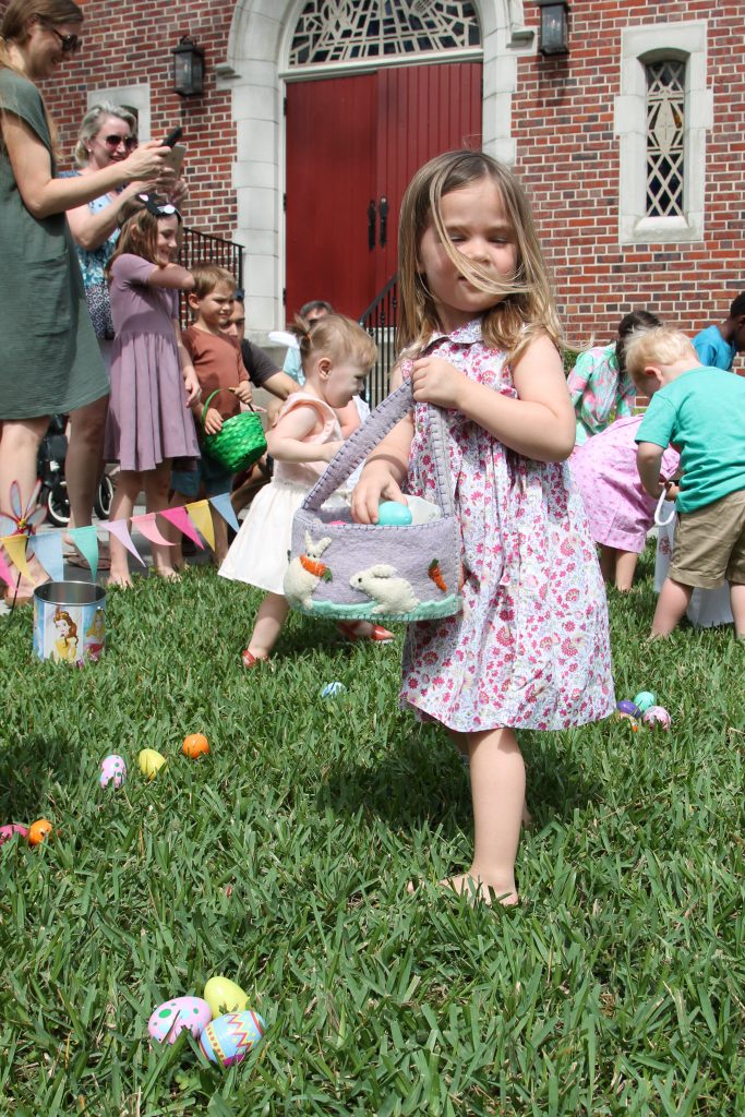 A little breeze captures this little girl's hair as she fills her cute basket with eggs during Holy Trinity Anglican Church's Easter Eggstravaganza April 13.
