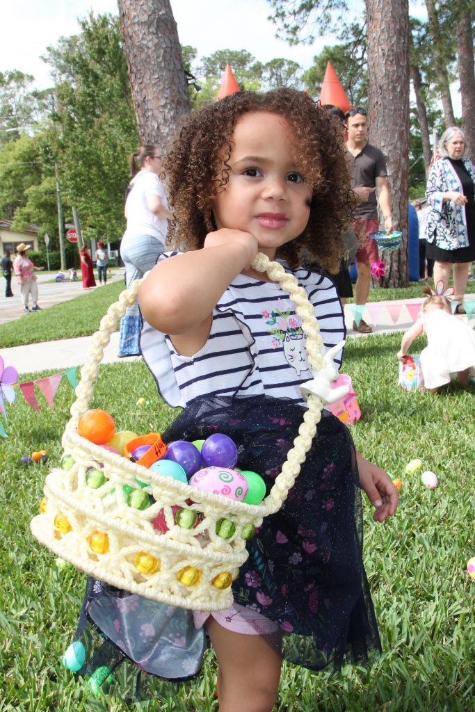 Jaina Cronedy holds a basket full of Easter eggs found during the Holy Trinity Anglican Church Easter Eggstravaganza April 13.