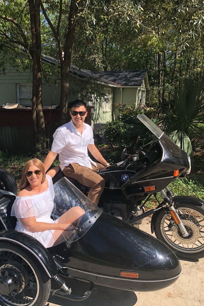 Britney and Geoffrey Muller on his 1981 BMW R65 motorcycle with sidecar.