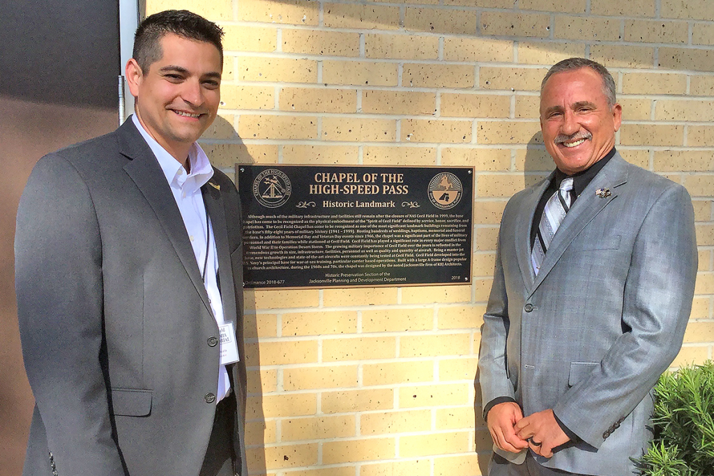 Michael Cassata and Buddy Harris at the plaque commemorating the chapel’s historic landmark status.