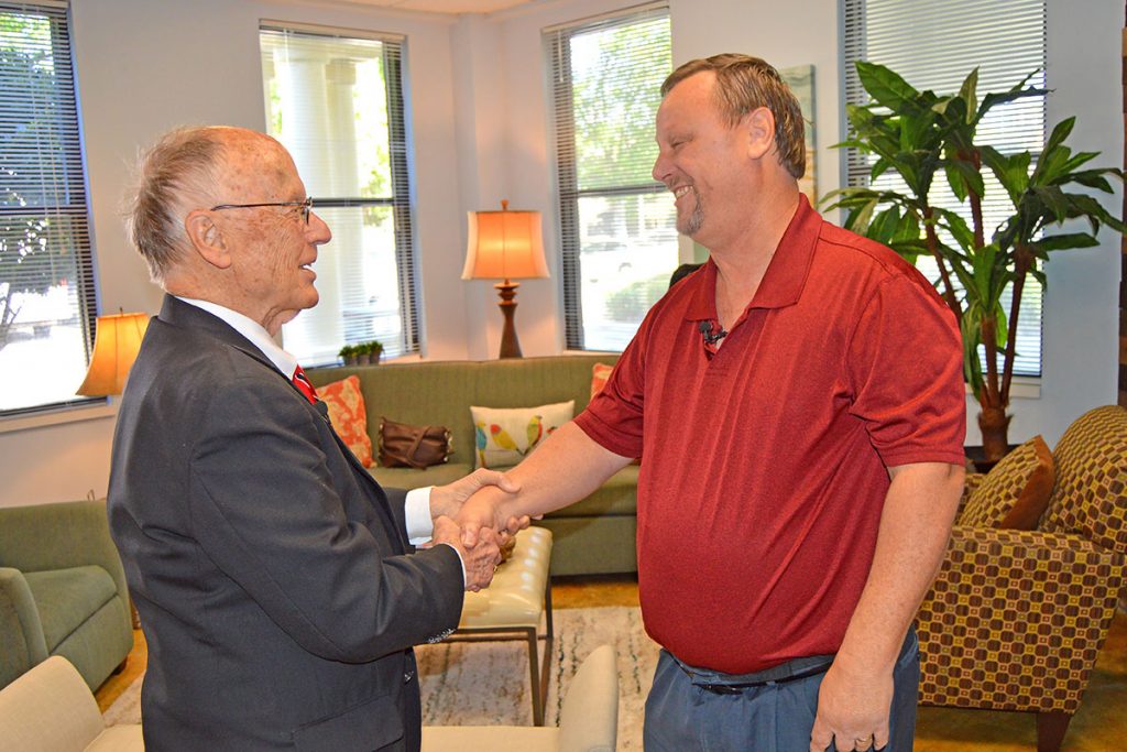 Dr. H. Warner Webb greets his former patient, Randy Highsmith, during a special reunion at Hope Haven March 22.