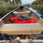 Trash from San Marco’s Craig Creek lines the bottom of Bryan Mickler’s canoe.