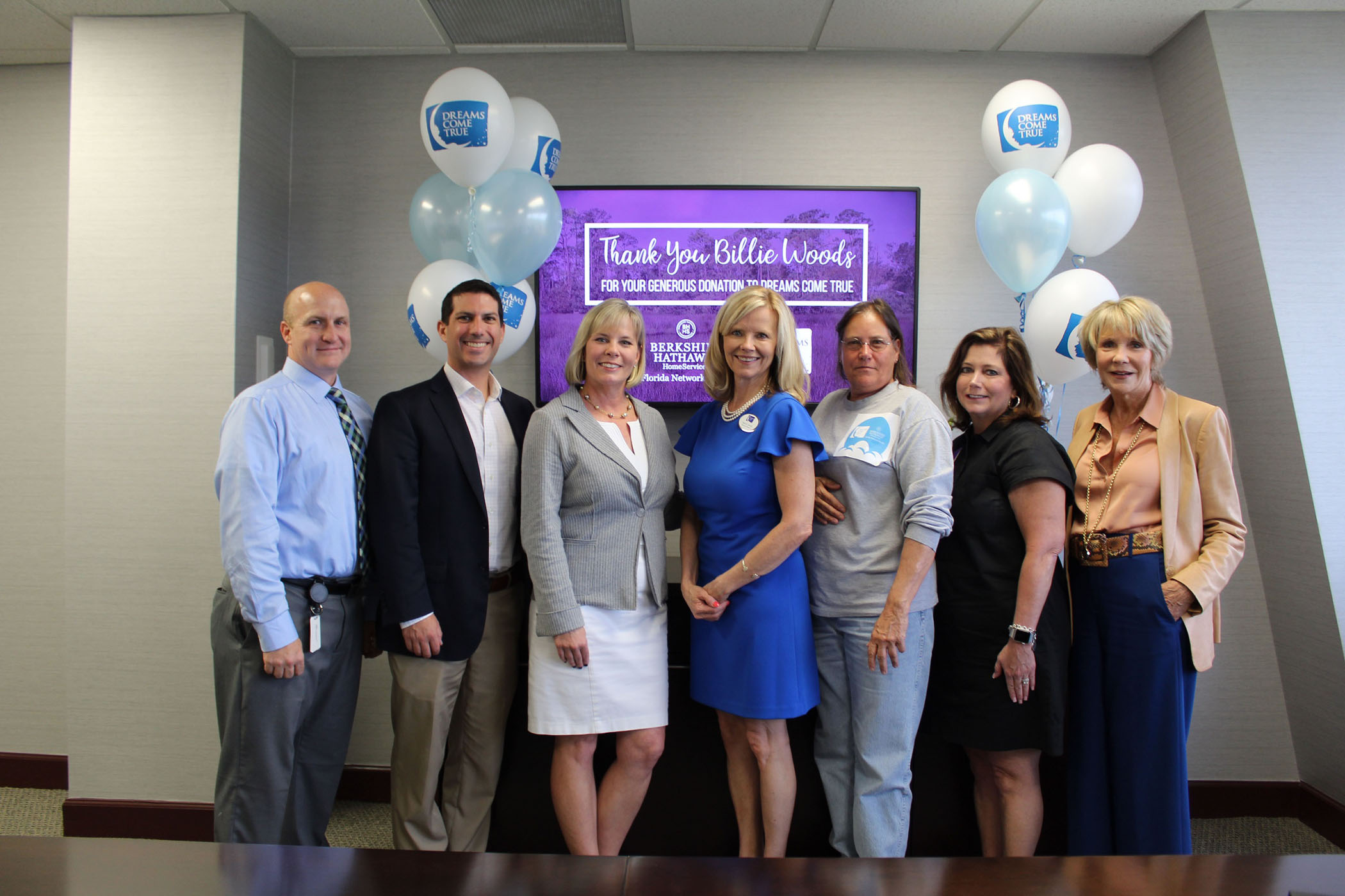 Dennis Luettich, associate counsel for Gibraltar Title Services; Eric Spottswood, regional market manager for Prosperity Home Mortgage; Christy Budnick, Berkshire Hathaway HomeServices Florida Network Realty president and CEO; Sheri Criswell, Dreams Come True Executive Director; Billie Woods, homesite owner; Liz Bobeck, realtor; and Linda Sherrer, Berkshire Hathaway HomeServices Florida Network Realty founder and chairman