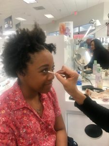Nekayla Hyles has her makeup done at the Navy Exchange for her prom.