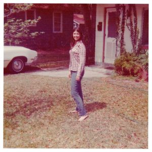 Mary Jane Blanchard in the yard of the house she grew up in on Felch Avenue in 1977