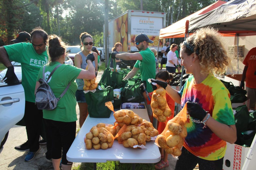 Volunteers with Feeding Northeast Florida help bag and distribute food on United Way's Day of Action June 21.