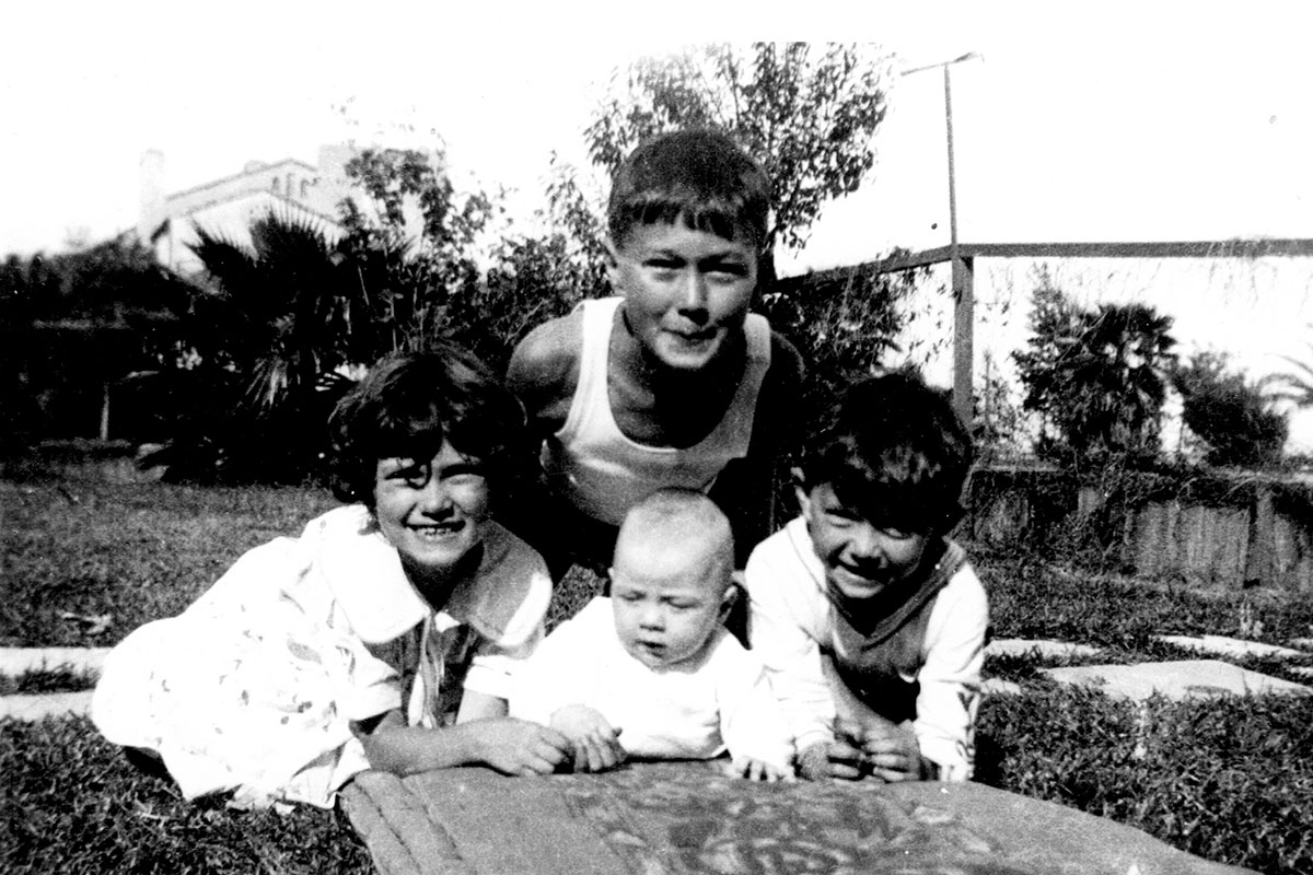 Henry with his siblings, Walter, Minerva and her twin, John, around 1933