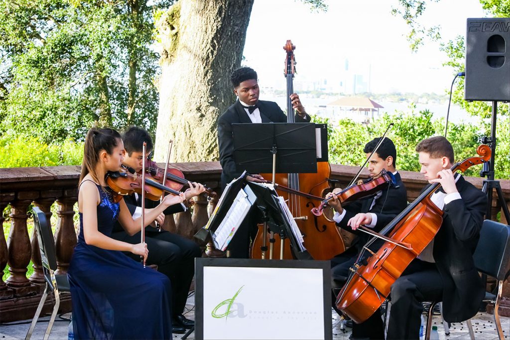 Musicians from Douglas Anderson School of the Arts perform during a reception at the Granada Riverfront home of Jacksonville Arts Patron Gary McCalla.