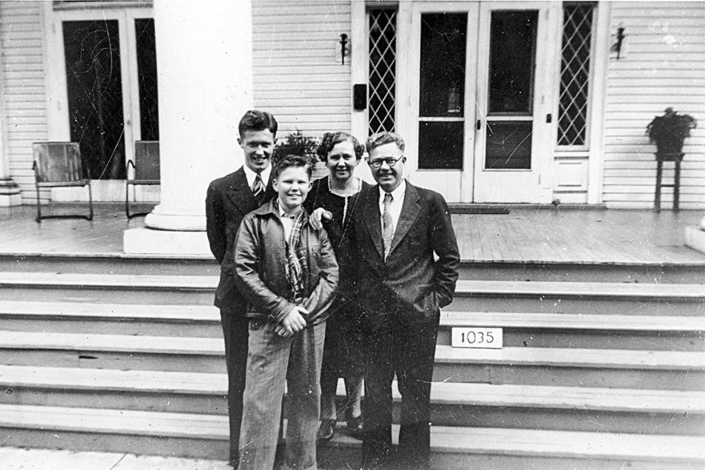 From left: Dr. William H. “Bill” Wood, Wayne W. Wood, and Wayne’s grandparents, Elma T. Wood and Guy D. Wood in front of the boarding house at 1035 Riverside Avenue.