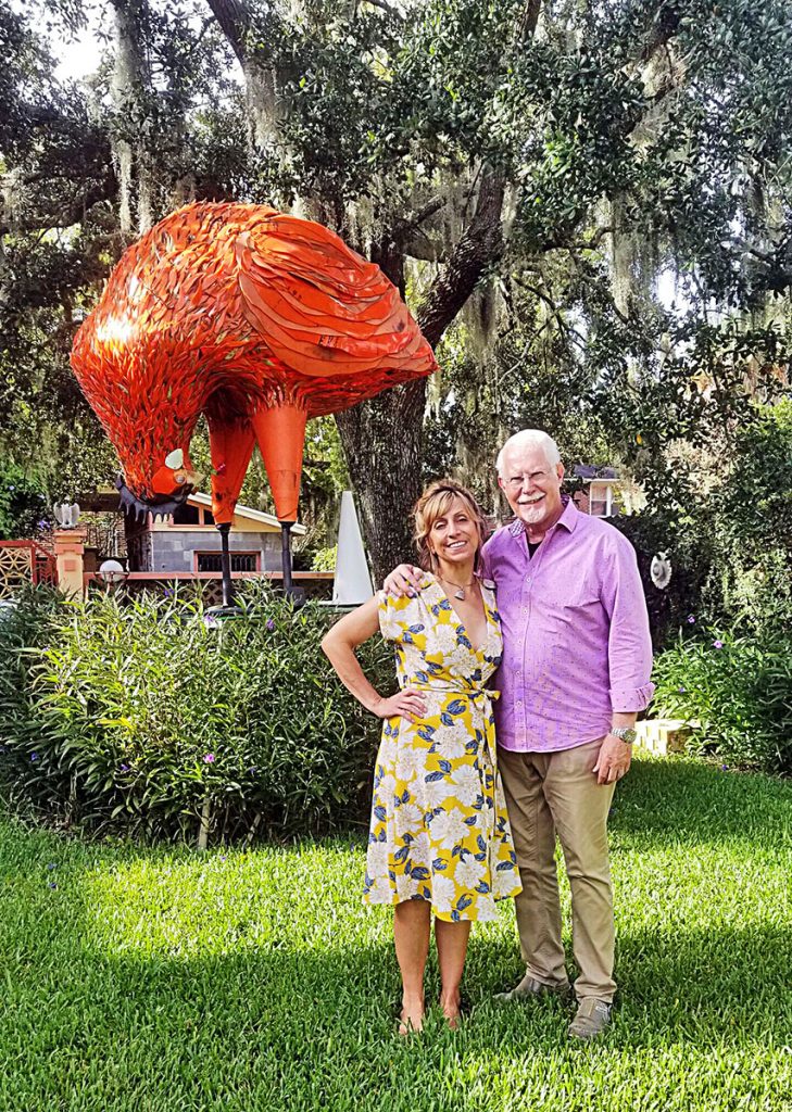 Lana Shuttleworth Wood and Wayne W. Wood near Lana’s chicken sculpture, made from traffic cones.