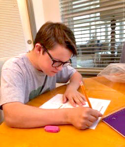 A student at North Florida School of Special Education completes an assignment.