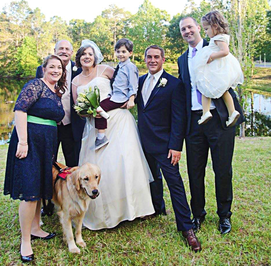 Melissa Leen Koch on her wedding day with son, William, Shiloh and her husband, Ryan, and other family members