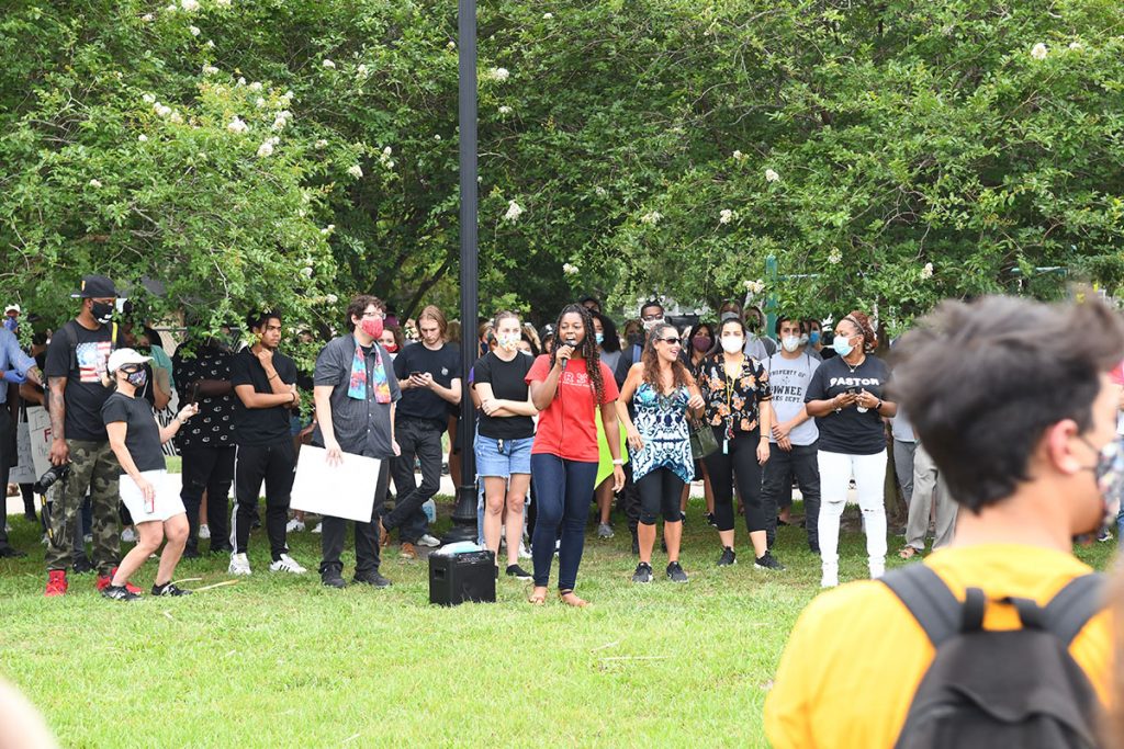 Protest organizer Michael Anderson (in black shirt and colorful stole) joined Mistress of Ceremonies Monique Sampson (with red shirt and microphone) of the Jacksonville Community Action Committee and Pastor Kimberley Pullings of Freedom Hills Chapel (right with black shirt) during the “I Can’t Breathe Reflection Walk” June 3 in Southside Park in San Marco.