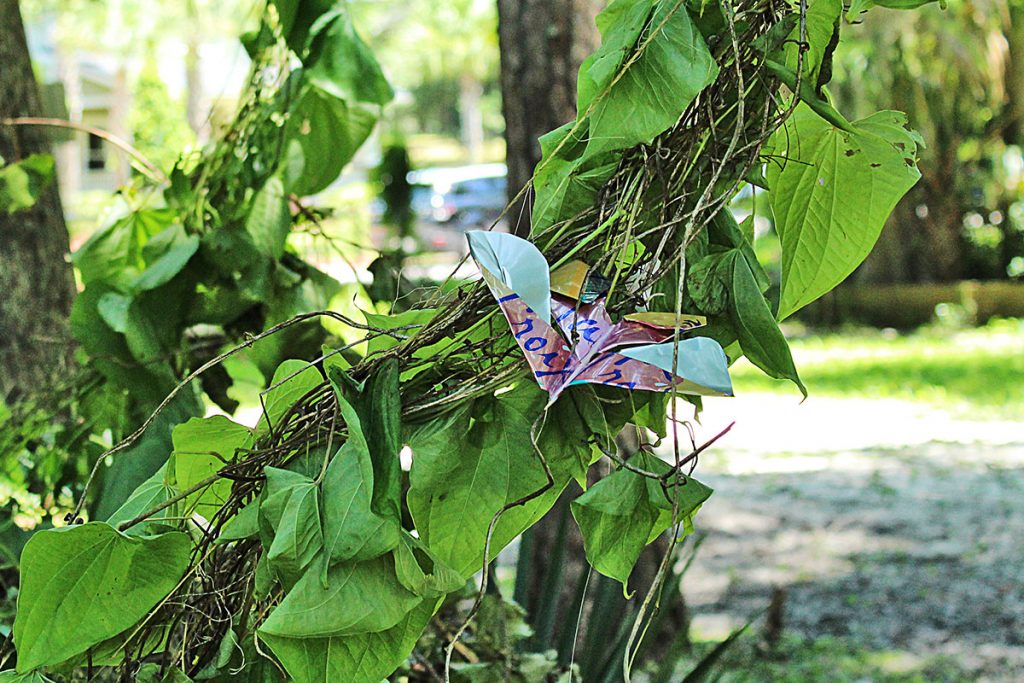 A aluminum butterfly rests on the vines in “The Human Cocoon,” the grand finale of FIGMENTJax’s Avondale treasure hunt.