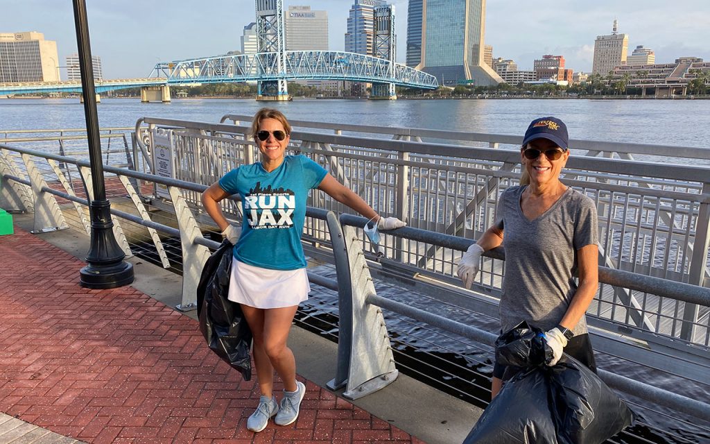 District 5 City Councilwoman LeAnna Cumber and her executive assistant Debra Rubin-Pataky pick up trash on theSouth Bank Riverwalk.