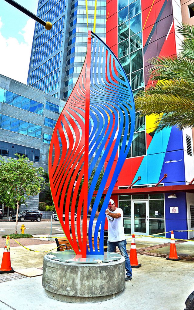 “NOVA” a sculpture created by Cecilia Lueza of south Florida is placed on its pedestal near the VyStar parking garage on Hogan Street.