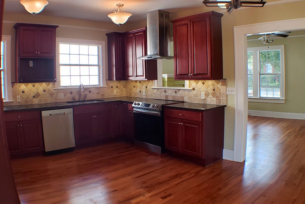 Lunn made significant upgrades to the kitchen, including granite countertops, custom maple cabinets, a deep undermount sink, garbage disposal, pass-through window over the range and under-cabinet LED lighting.