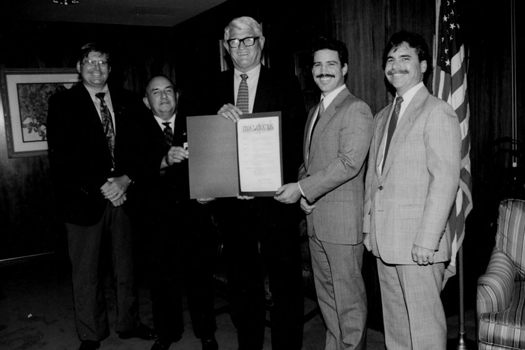 Then Mayor Ed Austin (center) presents Bishop Kenny Council 1951 members E.B. Hartley Jr., Past Grand Knight Steven A. Connor, Glenn H. Wilhoite and Past Grand Knight Eugene Hartley with a City Proclamation for 75 years of service in 1994.