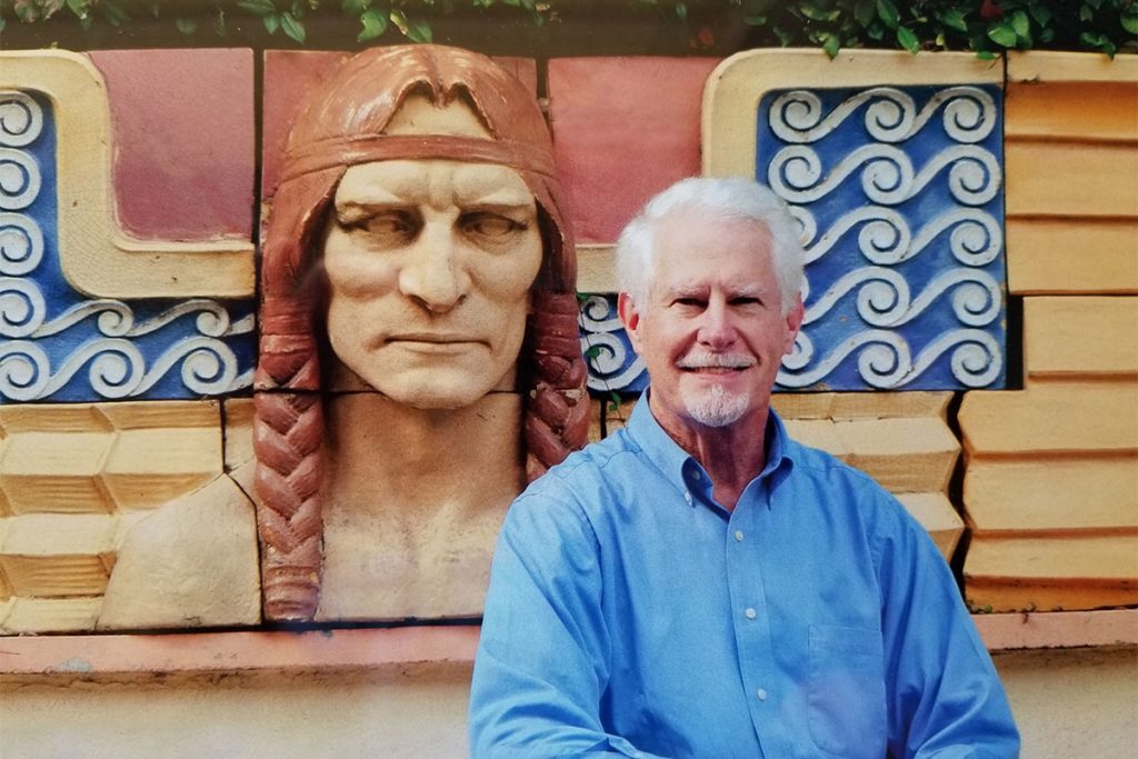 Wood, photographed in his backyard alongside salvaged artifacts he collects. This Indian was part in parcel of the frieze from the former Seminole Hotel in Downtown Jacksonville. photo by Tiffany Manning