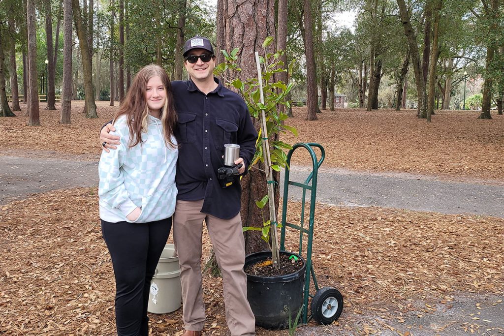 Sophia and Seth Williams ready for the planting of a Southern Magnolia