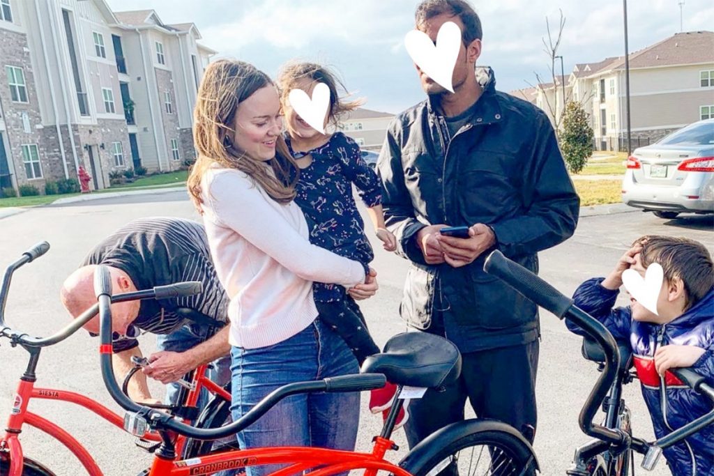 Katie Finn with man, two children, and bikes