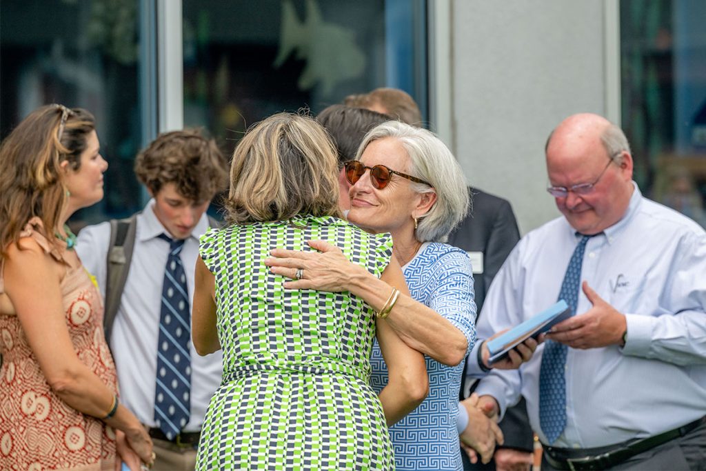 Owene Weber hugs Head of School Valorie Baker
