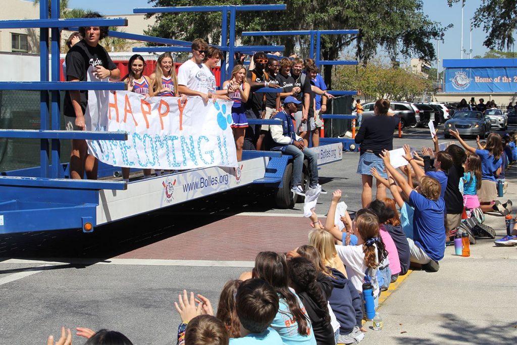 The 2022 Bolles Homecoming Court waved and threw candy to students on the Bolles Lower School Whitehurst Campus during the Homecoming parade on October 7.