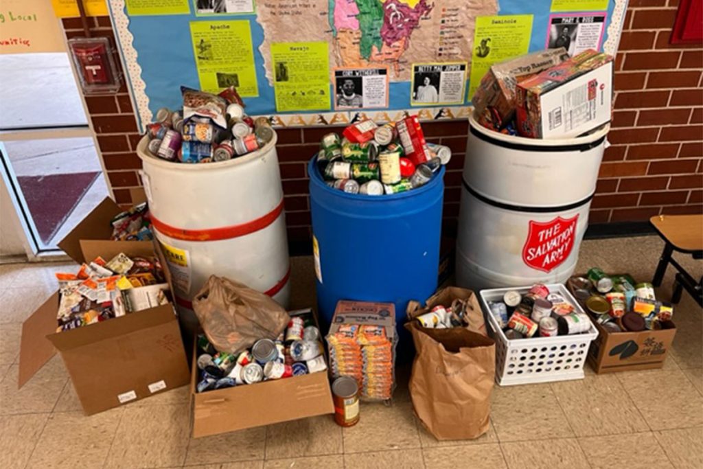 Stockton’s Teacher of the Year led a food drive that collected nearly 1,400 items for the Salvation Army.