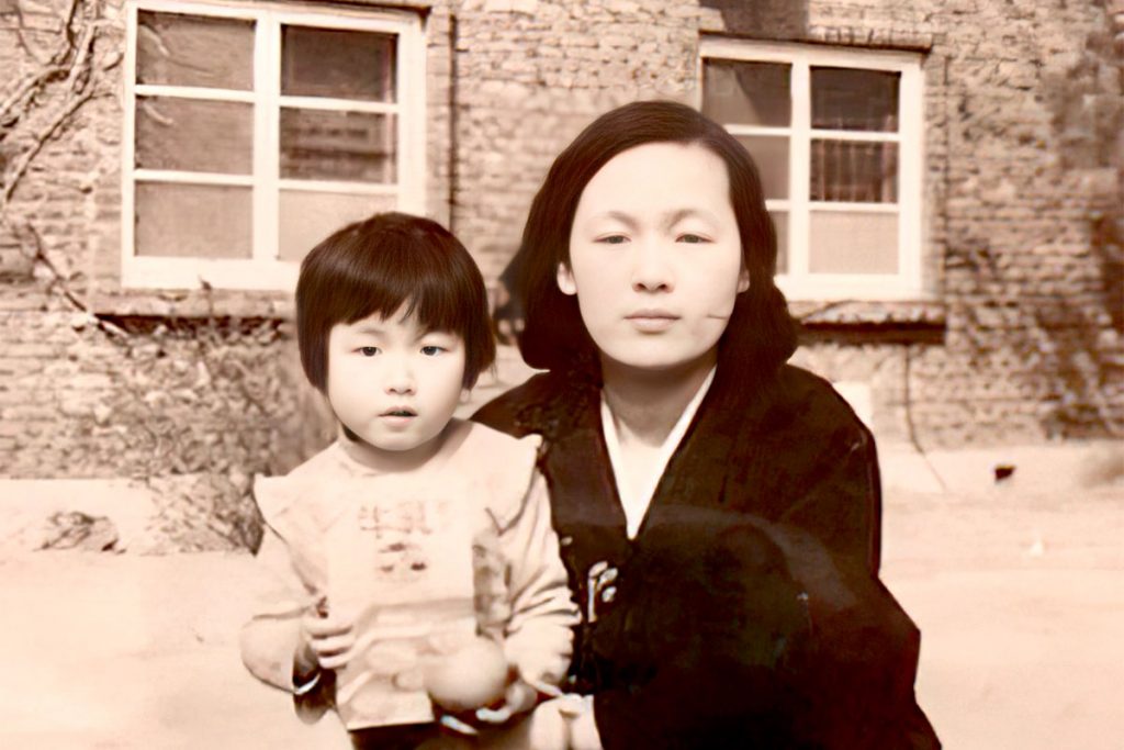Baby Amy and her birth mother at the orphanage in 1974.