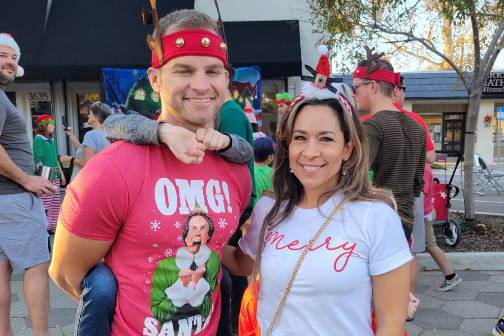 Avondale resident Jon Congdan channeled his inner ‘Buddy the Elf’ with his on-theme T-shirt with wife Delilah.