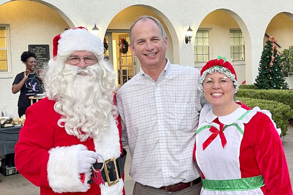 Ted Miller with Santa and Mrs. Claus.