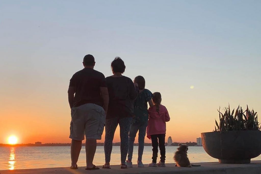 The Burnham family viewing sunset on Southbank Riverwalk