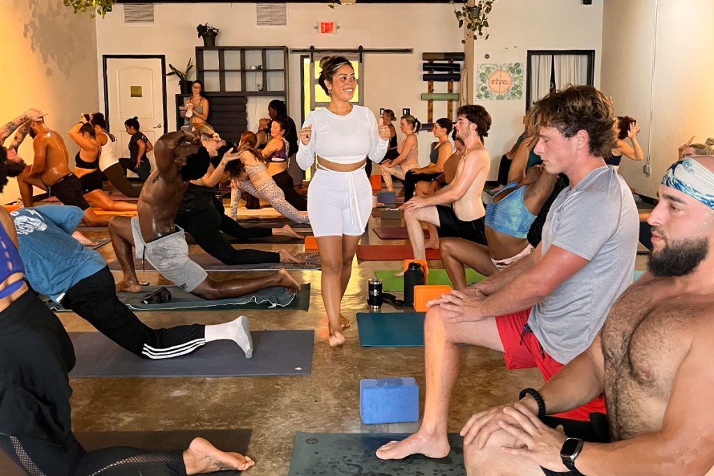 Macy Howard, daughter of Vive Yoga Studio Founder Alejandra Amegin, leading a yoga class.