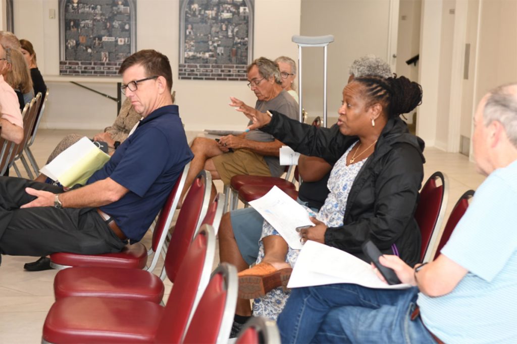Resident Yvette Primus shares her concerns about parking during the July 27 community meeting.
