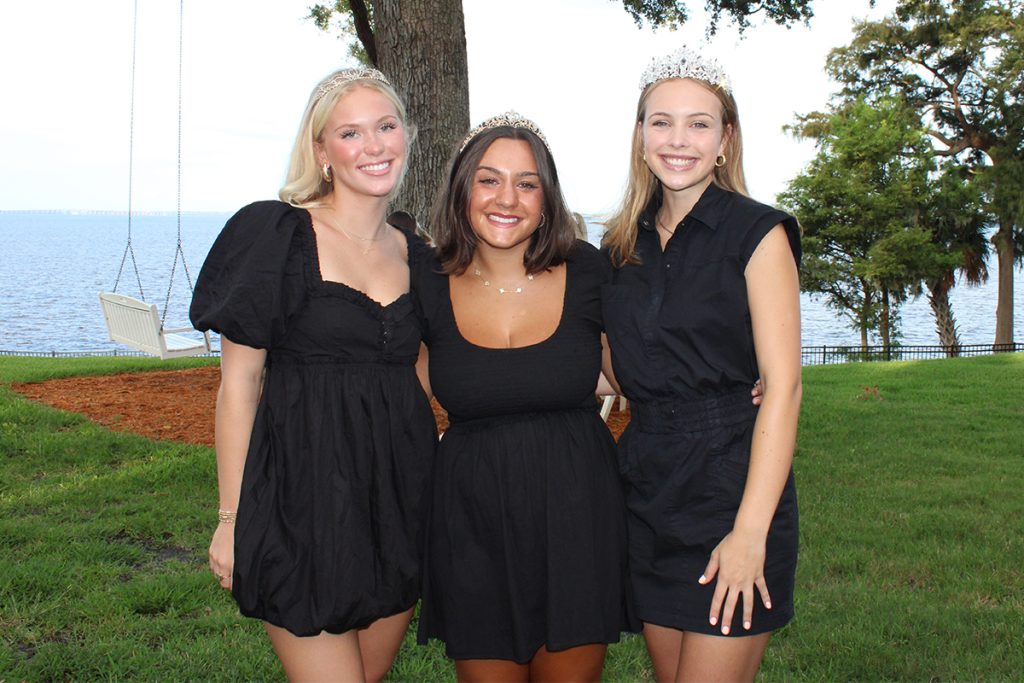 3 smiling teen girls with crowns