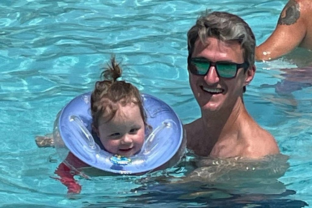 A special flotation device allows Aidyn to enjoy the pool.