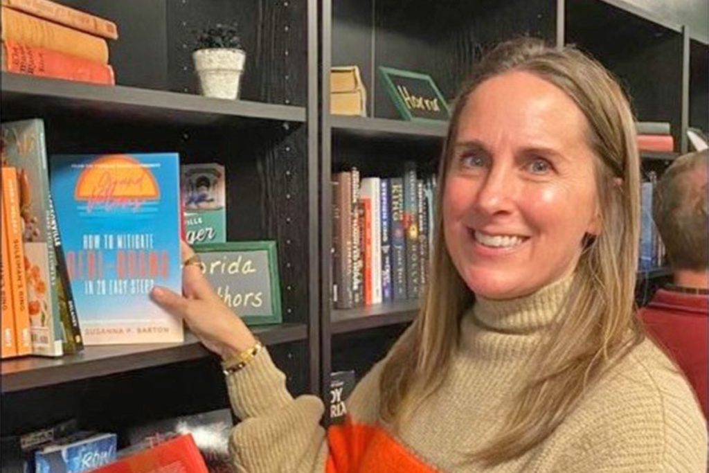 Susanna Barton shelves her book on the Local Authors shelf at the Literary Lounge in Murray Hill.