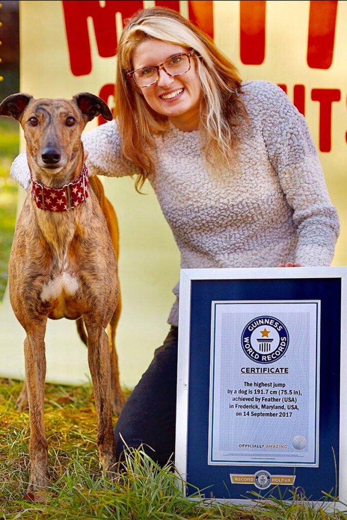 Feather, with her adopter and trainer Samantha Valle, is still unbeaten in her 2017 Guinness World Record Highest Jump by a Dog honor.