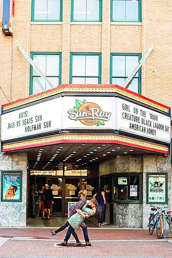 Nick and Josie Patterson striking a classic pose in front of Sun-Ray Cinema.