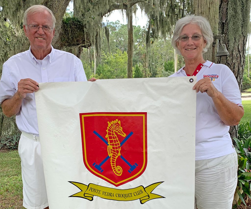 John Curington and Helen Covington with the Ponte Vedra Croquet Club Flag