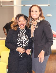 Jannet Walker Ford and Tracey Holzendorf, members of Bold City (FL) Chapter of the Links, Incorporated, attend the ribbon-cutting event on Jan. 25 for the grand opening of the stocked library for Sulzbacher Village.