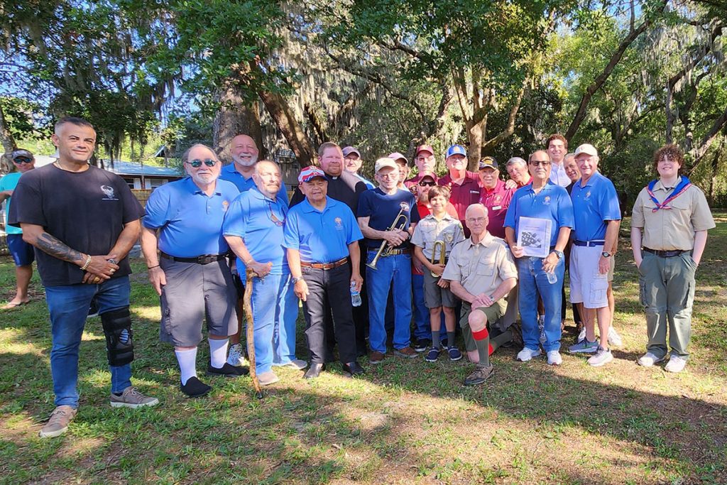 Knights of Columbus members and Boy Scouts smiling