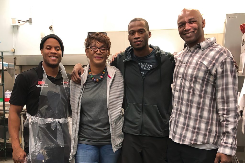 Giving back is a family affair for Ema Parks, shown here with her sons Marquise Pittman, Ellington Upshaw and Harry Upshaw.