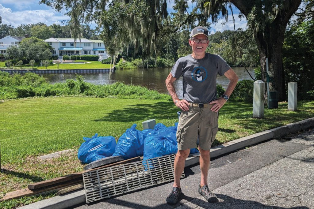Logan Cross participates in the River Oaks Park Clean Up event this past August, organized by San Marco Preservation Society and the St. Johns Riverkeeper.