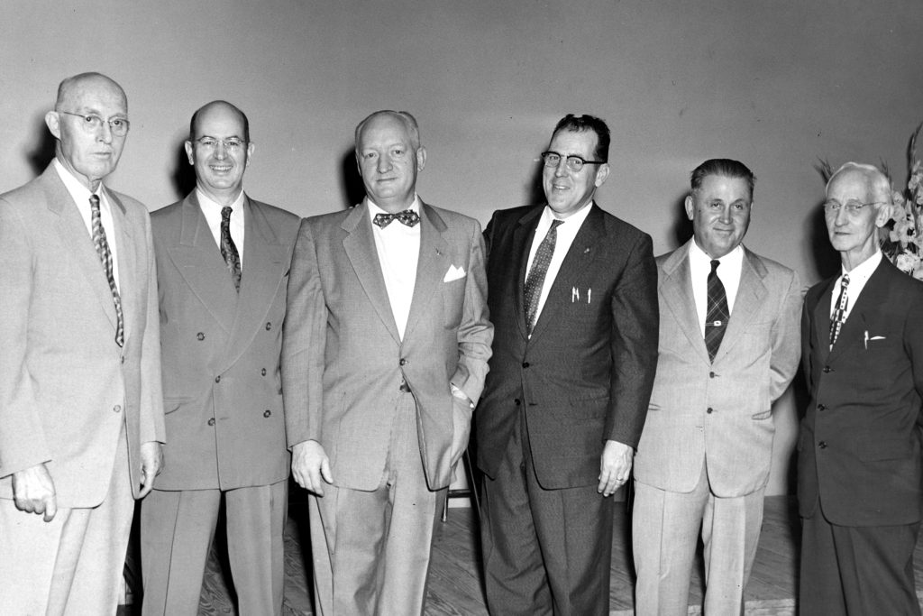 During the Southside Branch Library’s fifth anniversary meeting in 1955, Joseph F. Marron, chief librarian of the Jacksonville Public Library, is congratulated by Dr. Frank G. Slaughter, main speaker at the anniversary meeting; J. L. Dart, library trustee; George W. Martin; Carl V. Cesary; H. P. Osborn, library trustee; L. E. Hakes, former city councilman, and Dr. C. D. Rollins.