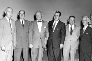 During the Southside Branch Library’s fifth anniversary meeting in 1955, Joseph F. Marron, chief librarian of the Jacksonville Public Library, is congratulated by Dr. Frank G. Slaughter, main speaker at the anniversary meeting; J. L. Dart, library trustee; George W. Martin; Carl V. Cesary; H. P. Osborn, library trustee; L. E. Hakes, former city councilman, and Dr. C. D. Rollins.