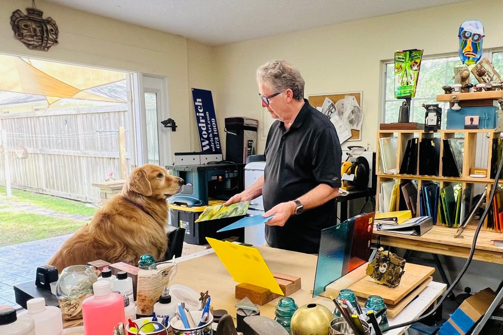 Mike and his golden retriever, Wicklow, in his workshop.